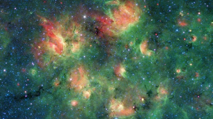Spitzer Observa una Región Estrellada Repleta de Burbujas